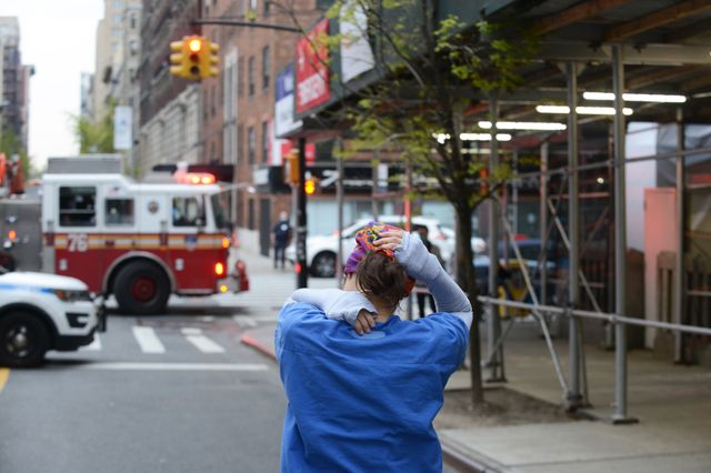 A tired nurse leaves Mt. Sinai Morningside Hospital in New York City, April 23rd, 2020.